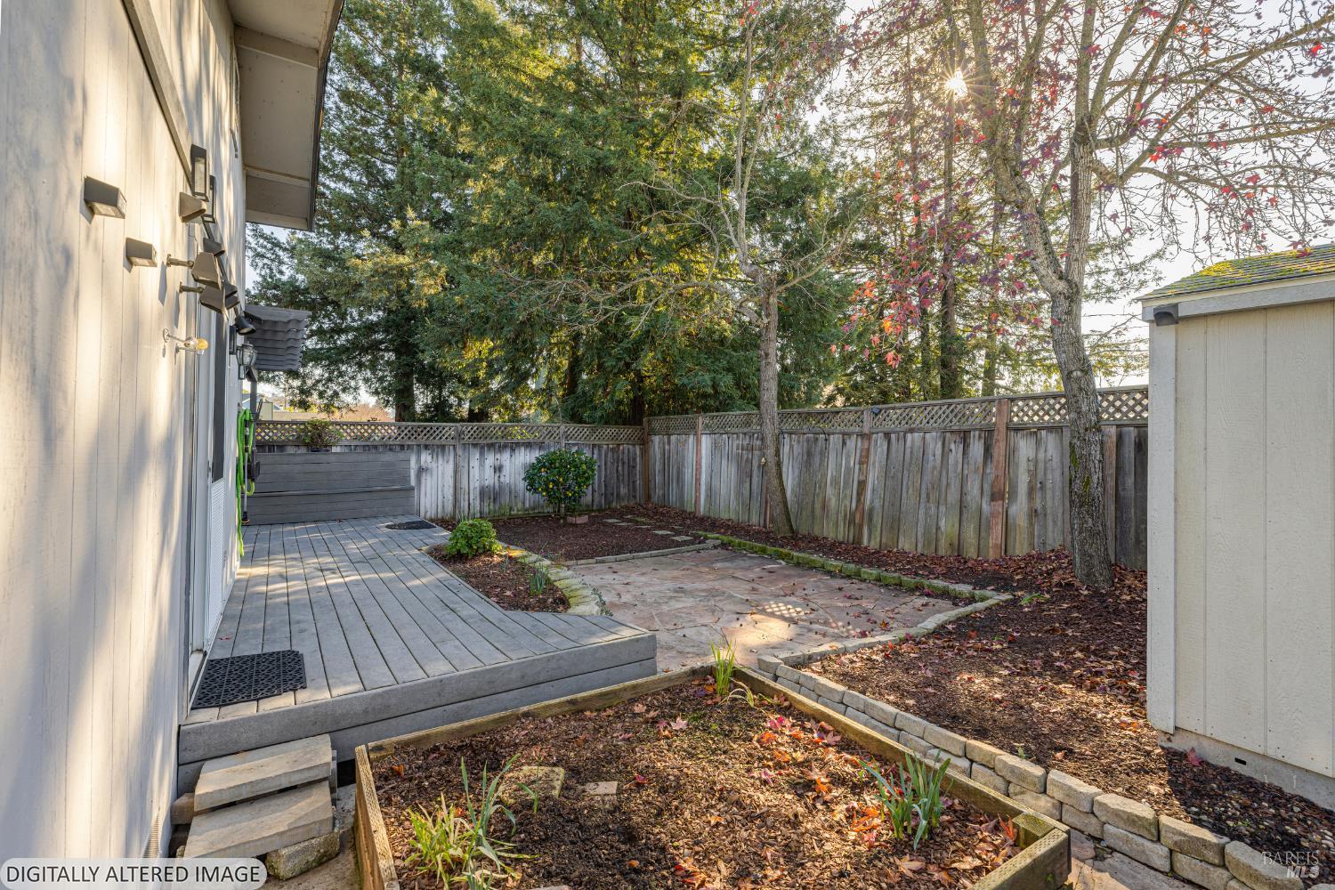 1387 Gillpepper Lane Rohnert Park, CA 94928 - Photo 28 of 36 a view of backyard with wooden fence and a large tree