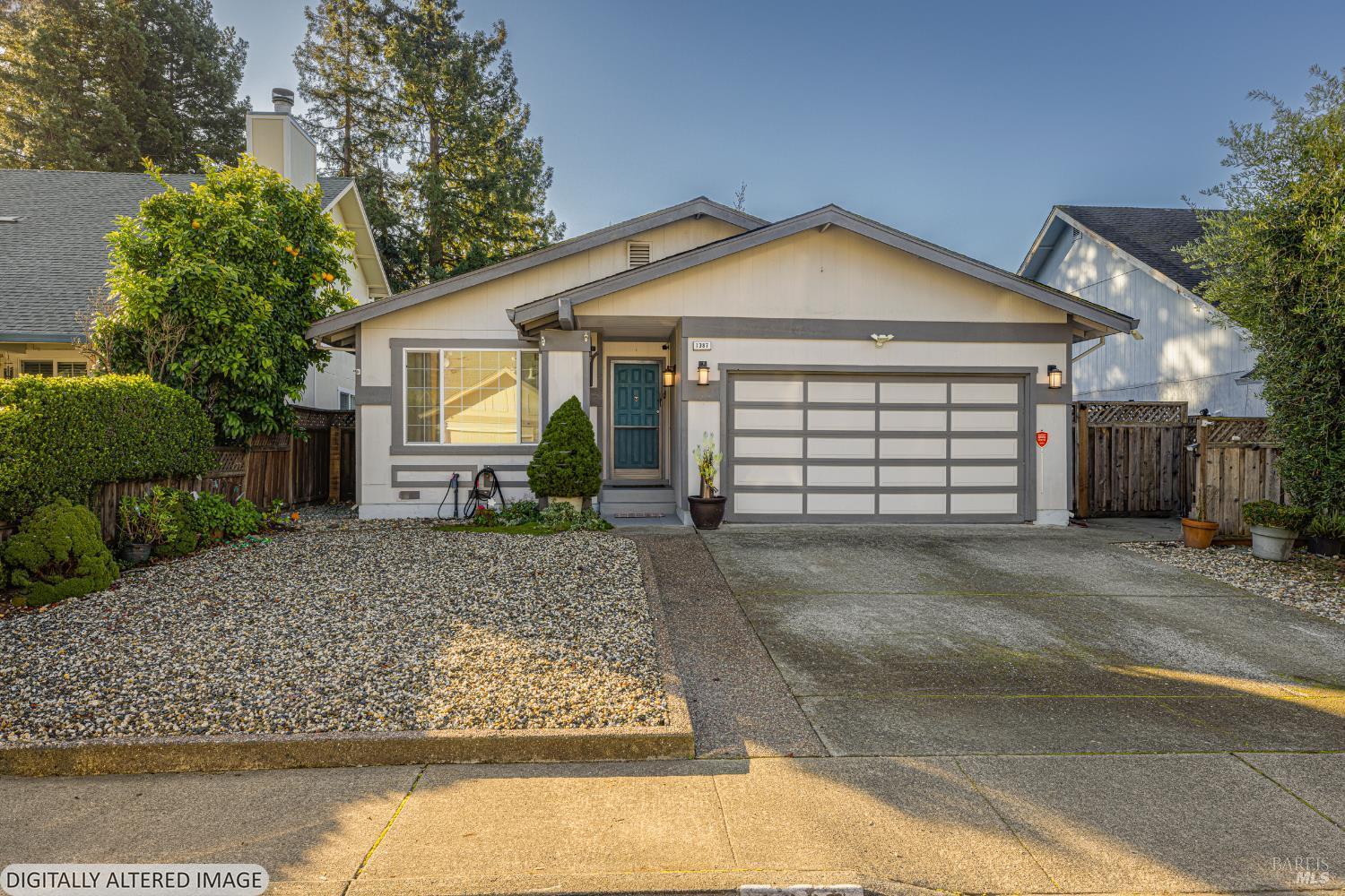 1387 Gillpepper Lane Rohnert Park, CA 94928 - Photo 31 of 36 a front view of a house with a yard and garage