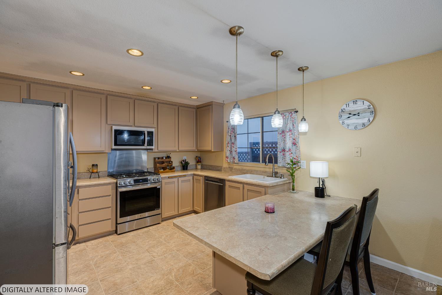 1387 Gillpepper Lane Rohnert Park, CA 94928 - Photo 9 of 36 a kitchen with stainless steel appliances granite countertop a sink a stove a refrigerator cabinets a dining table and chairs