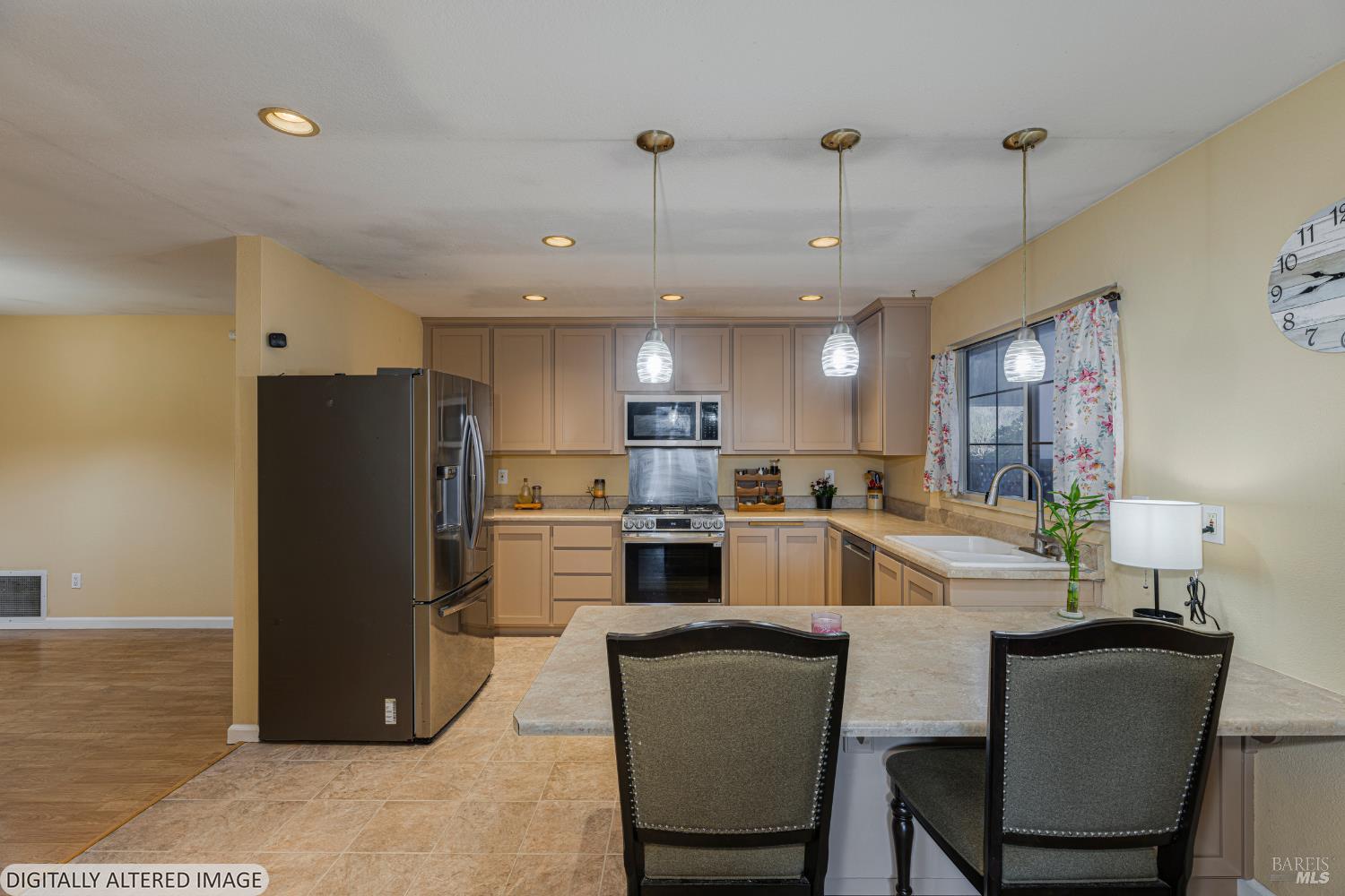 1387 Gillpepper Lane Rohnert Park, CA 94928 - Photo 10 of 36 a kitchen with refrigerator a microwave and chairs