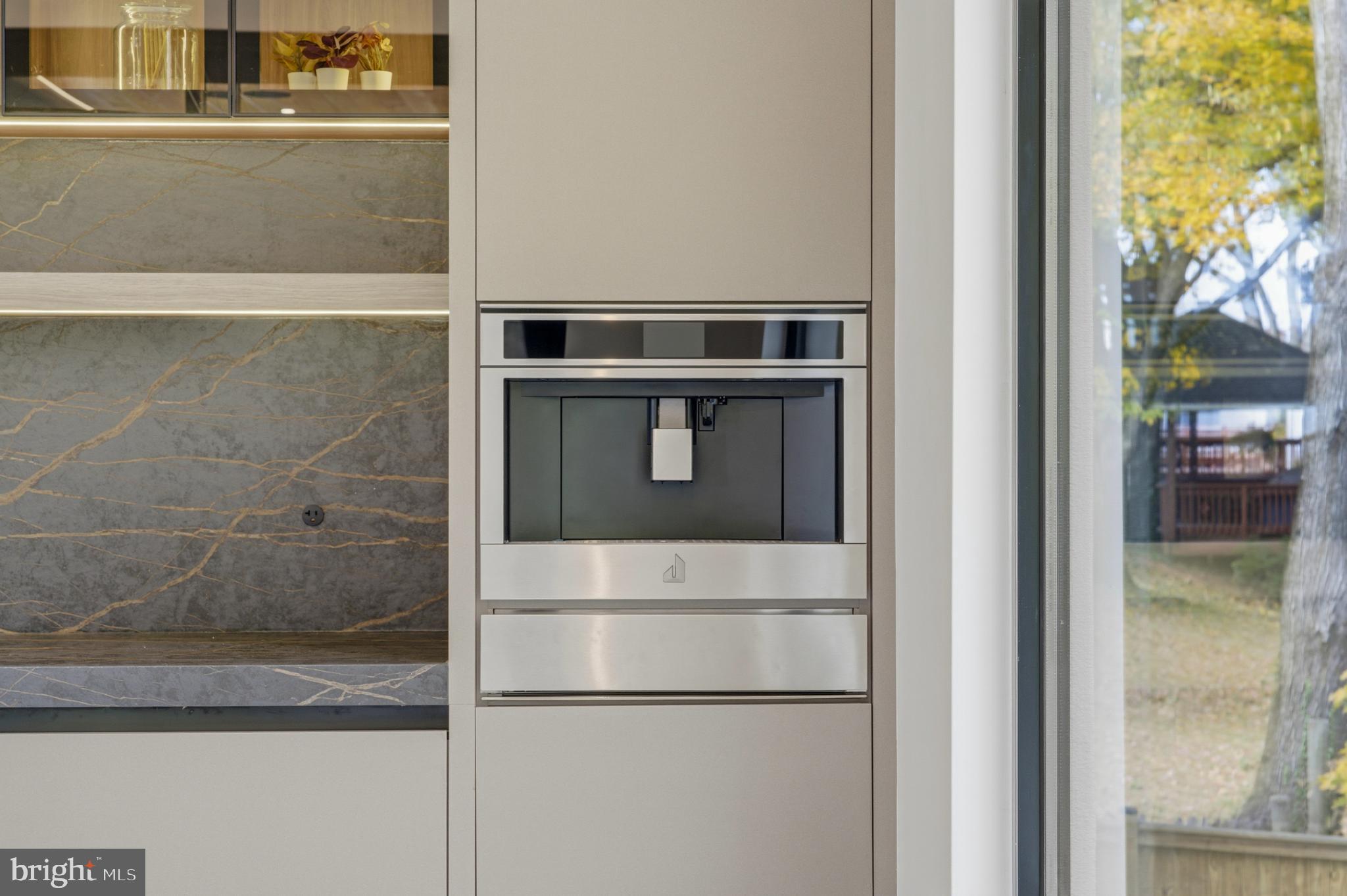9408 Old Courthouse Road Vienna, VA 22182 - Photo 29 of 92 Sleek modern kitchen with elegant finishes.