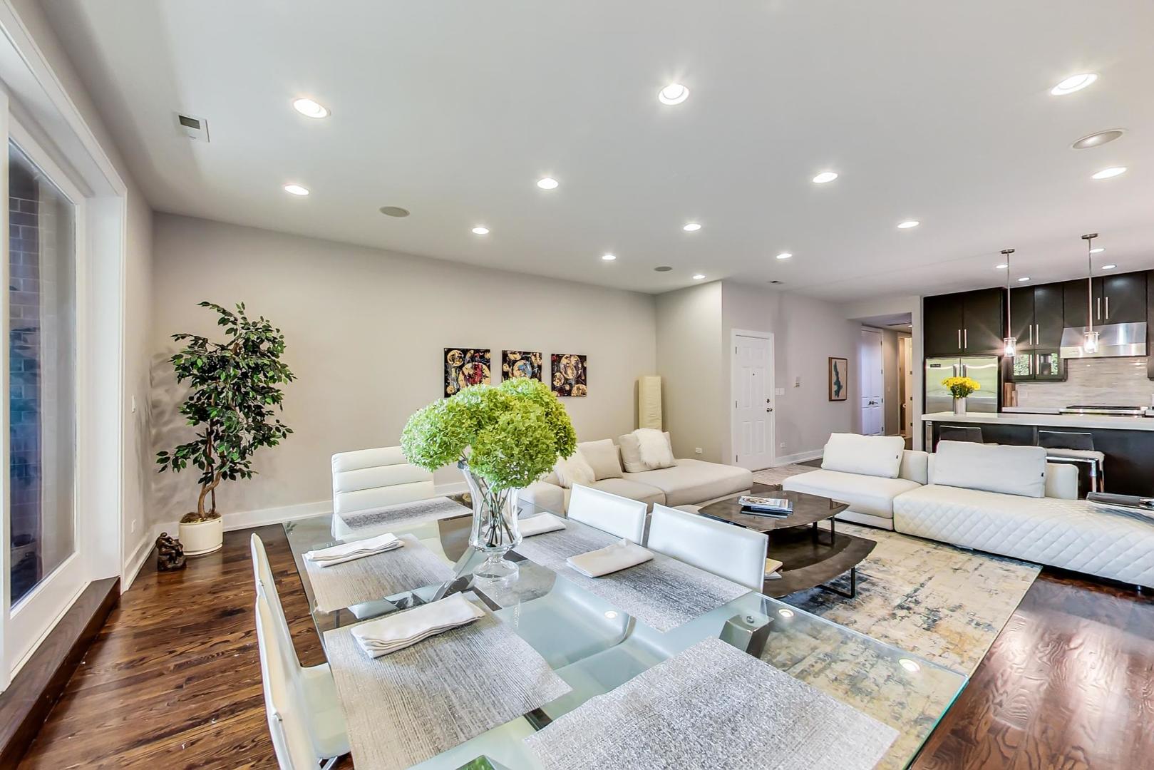2144 West Rice Street, Unit 3E Chicago, IL 60622 - Photo 2 of 19 a living room with furniture potted plant and a window