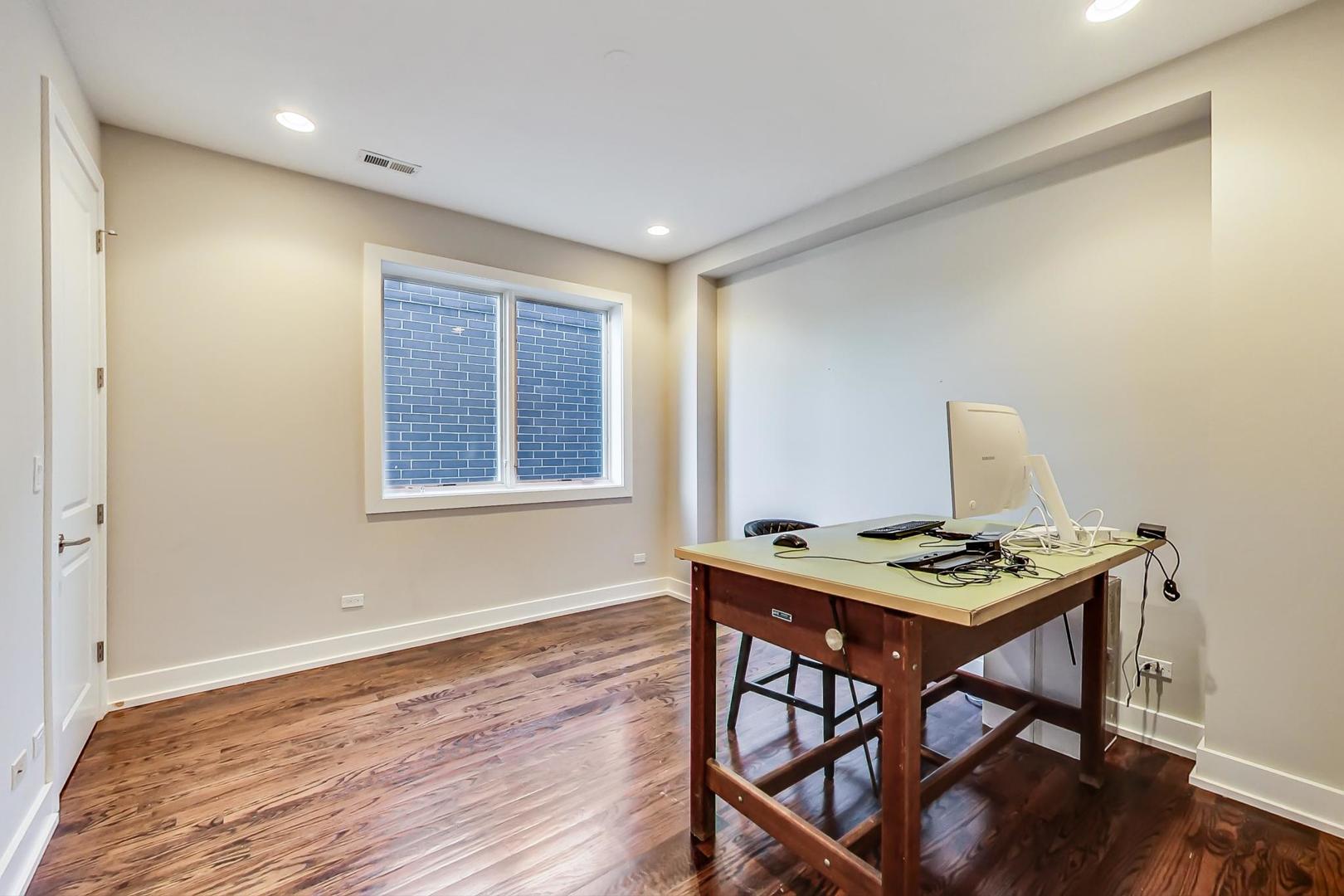 2144 West Rice Street, Unit 3E Chicago, IL 60622 - Photo 4 of 19 a workspace with furniture and window