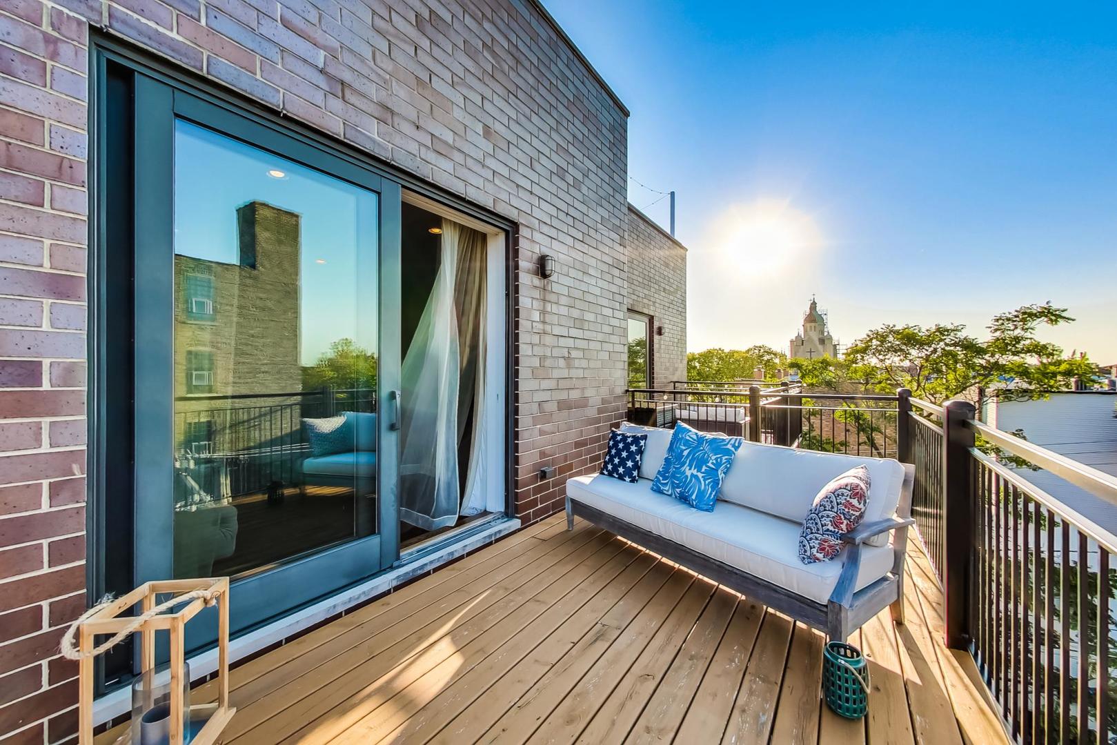 2144 West Rice Street, Unit 3E Chicago, IL 60622 - Photo 10 of 19 a view of a balcony with furniture