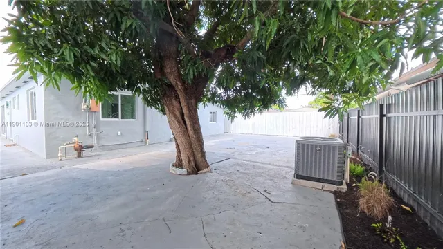 a backyard of a house with seating space