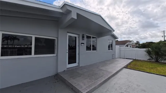 a view of a house with backyard and a window