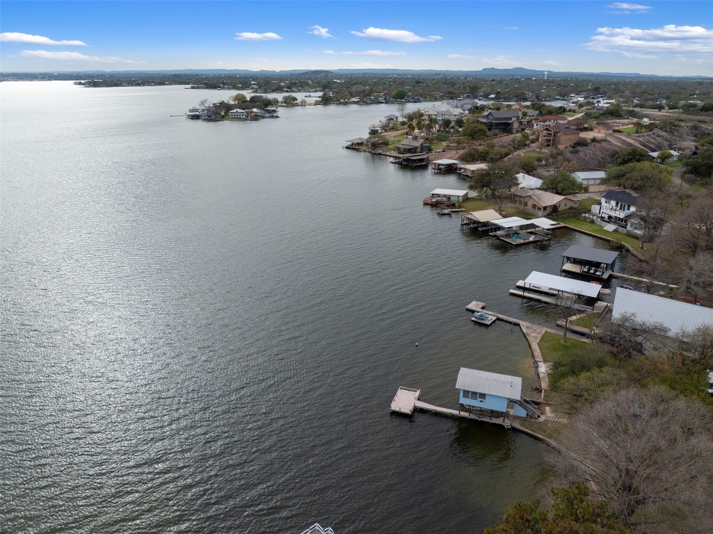 an aerial view of a houses with a lake view