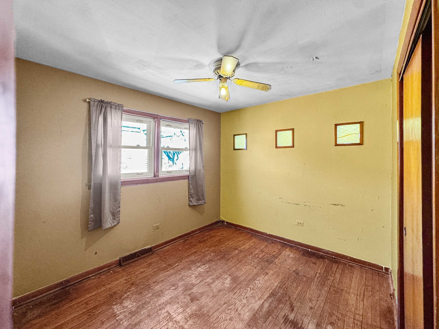 12326 South Indiana Avenue Chicago, IL 60628 - Photo 7 of 14 wooden floor in an empty room with a window