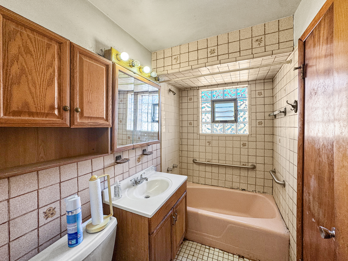 12326 South Indiana Avenue Chicago, IL 60628 - Photo 9 of 14 a bathroom with a sink toilet tub and shower