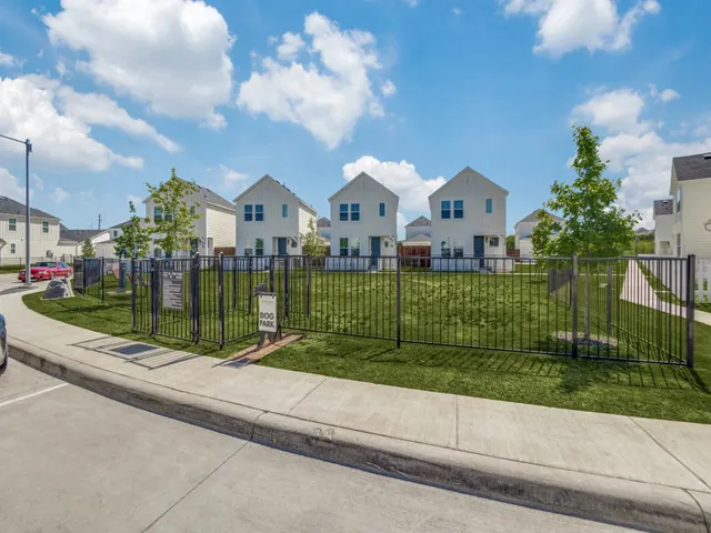 a view of a garden in front of a house