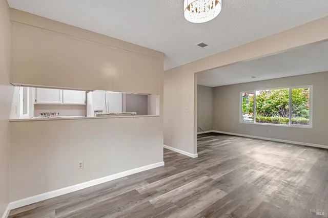 a view of empty room with floor to ceiling window
