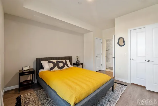 a bedroom with a bed and a couch