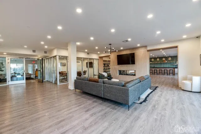a view of kitchen with furniture and wooden floor