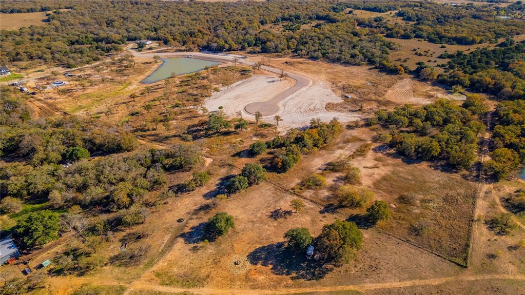 Lot 6 Suade Way Weatherford, TX 76088 - Photo 16 of 18 a view of a yard with snow on the road