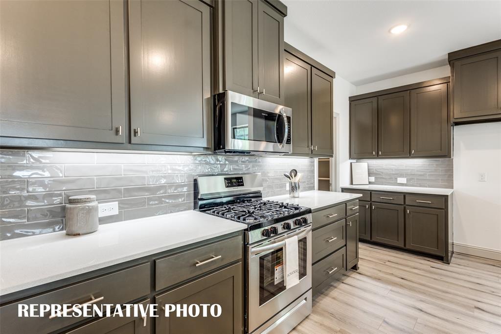 2844 Chisos Red Road McKinney, TX 75071 - Photo 5 of 13 A beautiful backsplash, stainless appliances, pot & pan drawers and so much more can be found in this over the top kitchen! REPRESENTATIVE PHOTO.
