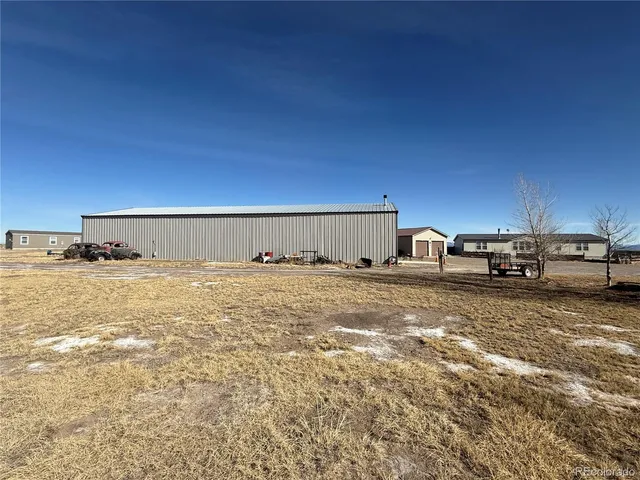a view of a large building with cars