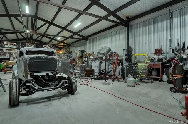 a view of parking garage with cars