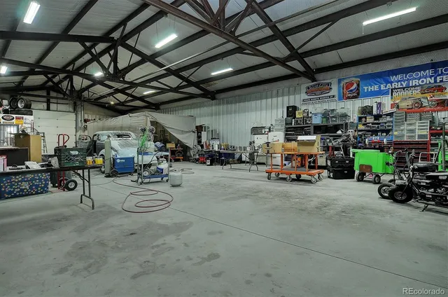 a view of parking garage with cars and a bike