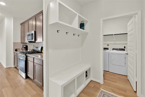 a kitchen with cabinets and stainless steel appliances