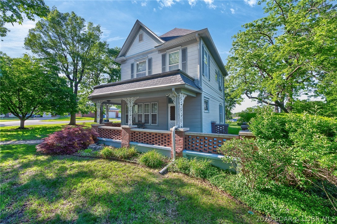 601 East Newton Street Eldon, MO 65026 - Photo 30 of 61 The grand wraparound porch is the heart of this hi