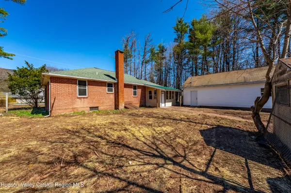 a house view with a backyard space
