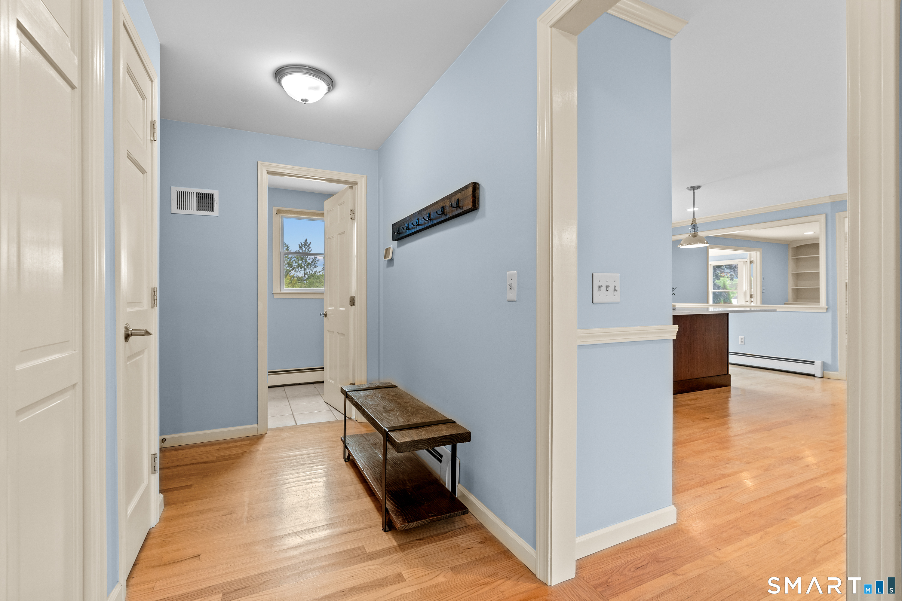 71 Quail Run Road Suffield, CT 06078 - Photo 9 of 40 Entryway from the garage includes lots of closet space, half bath, and laundry room.