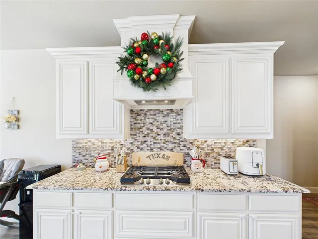 a bathroom with a sink a vanity and a window