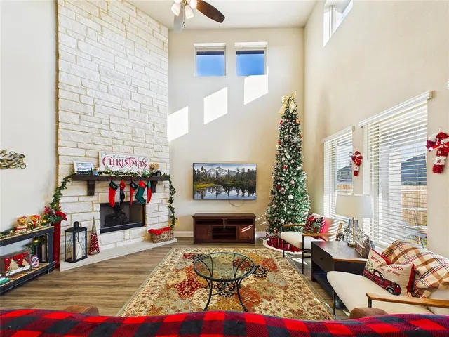 a living room with furniture and a book shelf