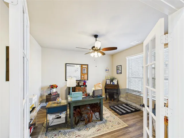 a living room with furniture a rug and a chandelier