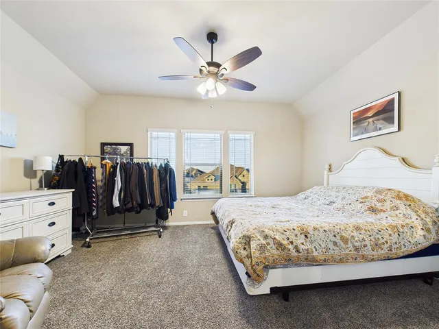 a bedroom with a bed and a walk in closet