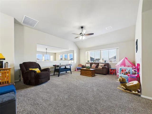 a living room with furniture and a couch