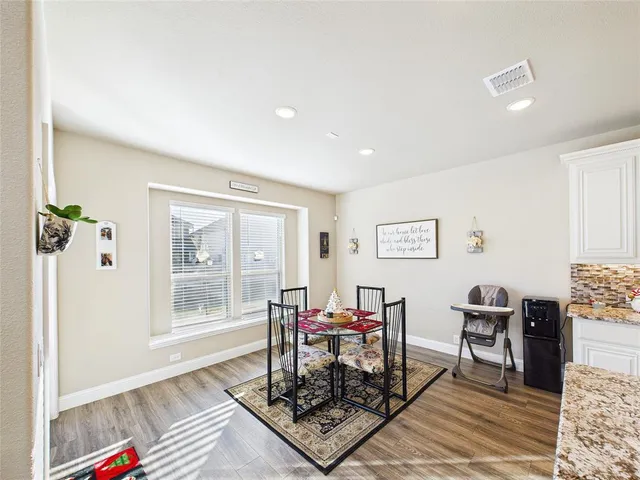 a living room with furniture and next to a window
