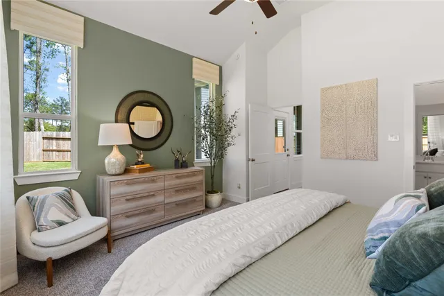 a bedroom with a bed and a couch