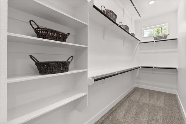 a view of a hallway with closet