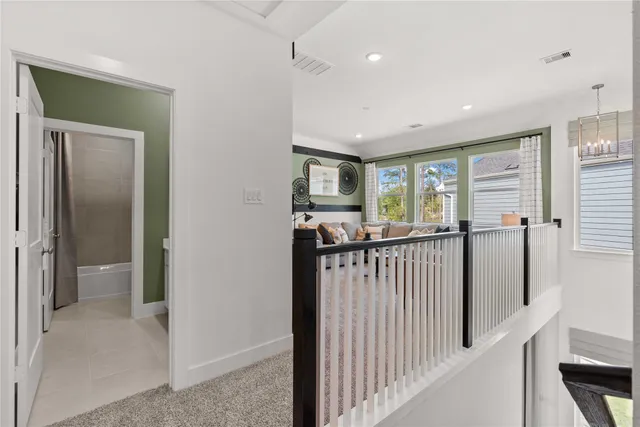 a view of a hallway with walk in closet