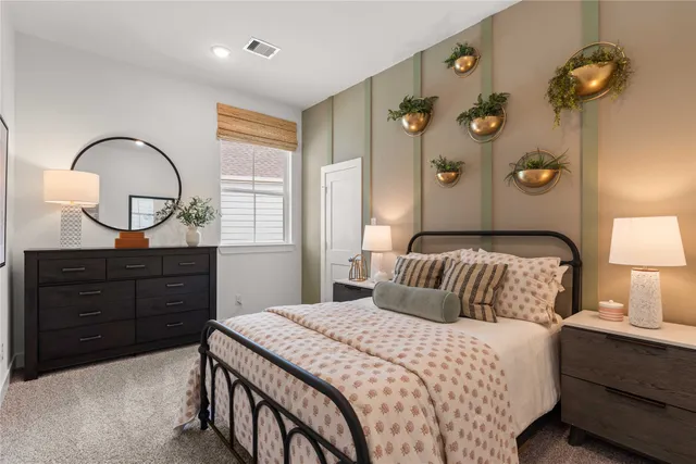 a bedroom with a bed and a dresser