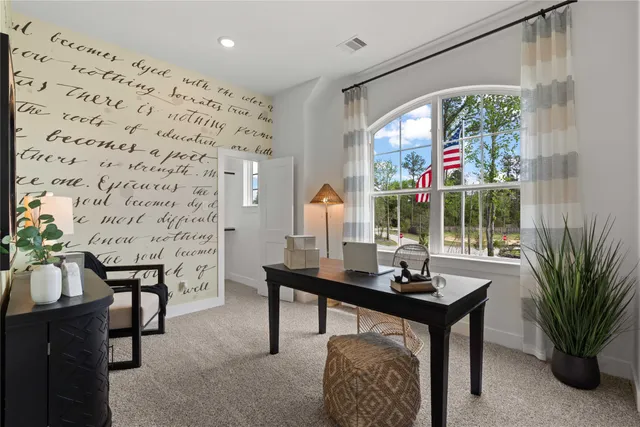 a view of a livingroom with furniture and window