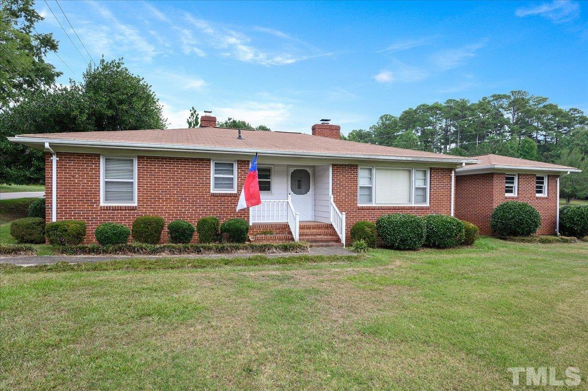 755 Wait Avenue Wake Forest, NC 27587 - Photo 1 of 23 a view of a house with a yard
