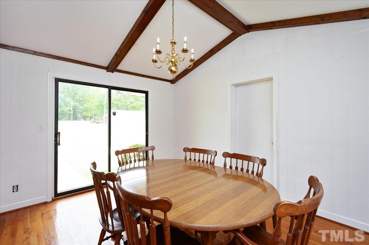 755 Wait Avenue Wake Forest, NC 27587 - Photo 11 of 23 a view of a dining room with furniture window and wooden floor