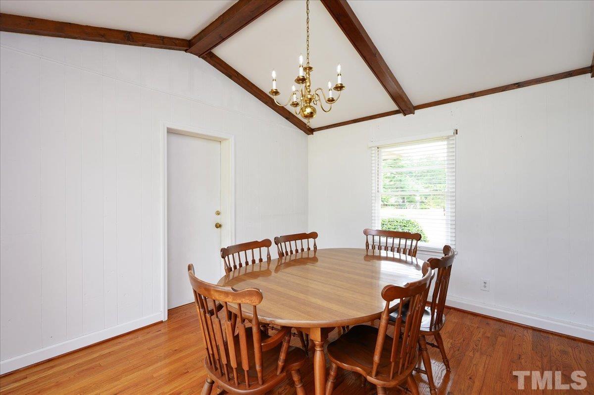755 Wait Avenue Wake Forest, NC 27587 - Photo 12 of 23 a view of a dining room with furniture and wooden floor