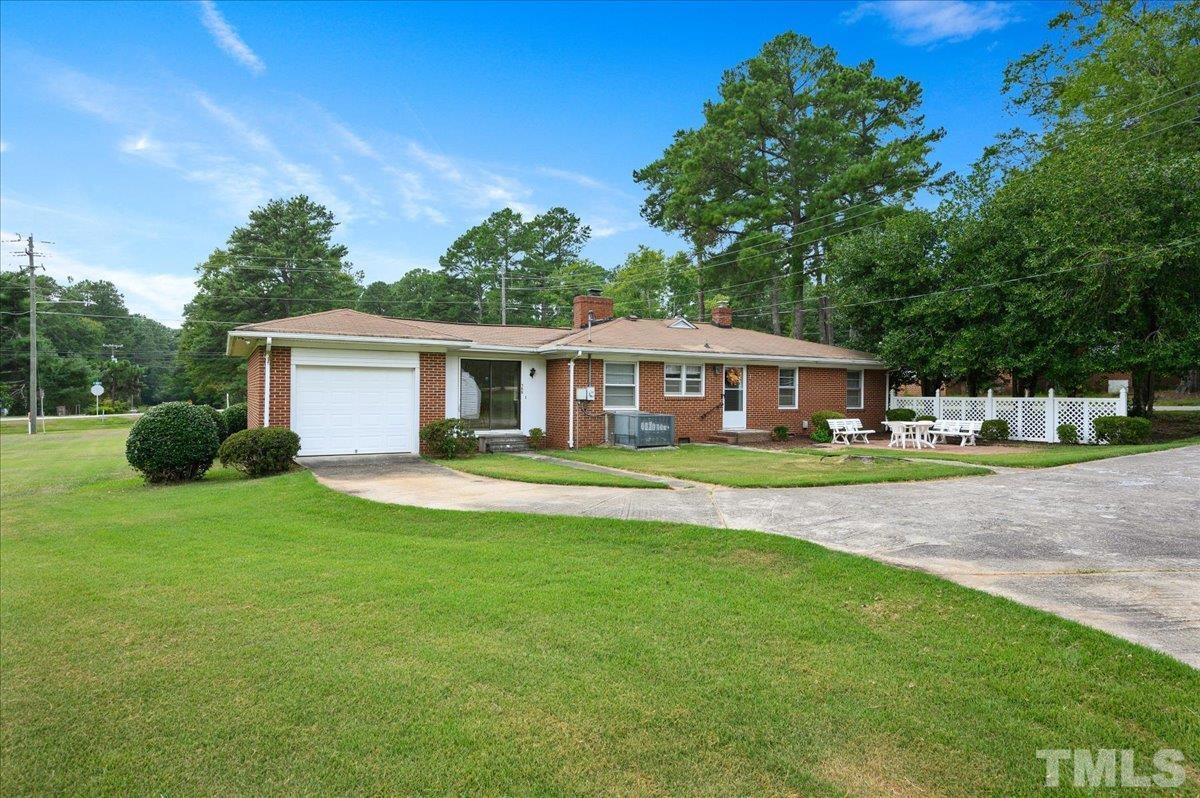 755 Wait Avenue Wake Forest, NC 27587 - Photo 19 of 23 a front view of a house with a yard