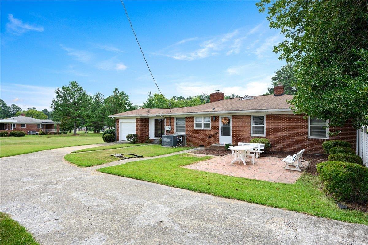 755 Wait Avenue Wake Forest, NC 27587 - Photo 20 of 23 a front view of a house with garden and porch