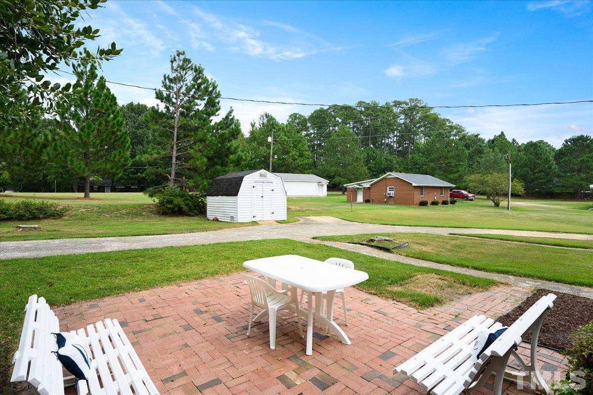 755 Wait Avenue Wake Forest, NC 27587 - Photo 21 of 23 a view of a table and chairs in the garden