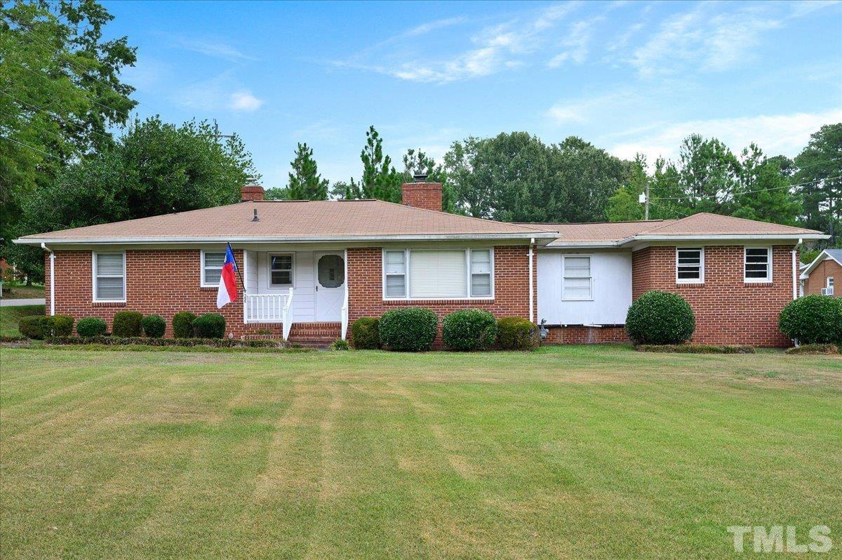 755 Wait Avenue Wake Forest, NC 27587 - Photo 23 of 23 a front view of a house with a garden