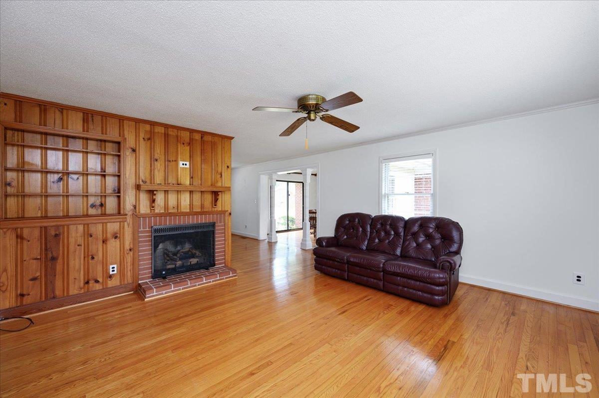 755 Wait Avenue Wake Forest, NC 27587 - Photo 5 of 23 a living room with furniture or fireplace and a wooden floor