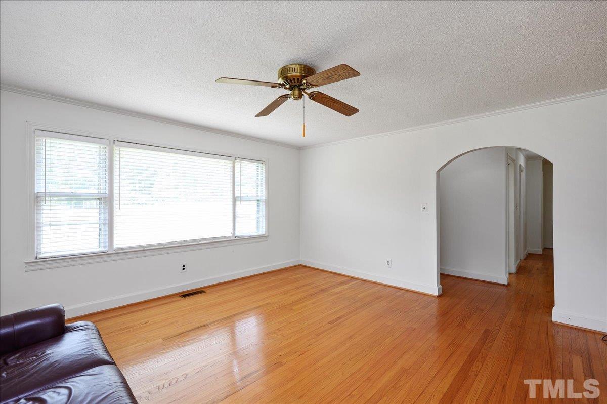 755 Wait Avenue Wake Forest, NC 27587 - Photo 6 of 23 a view of empty room with wooden floor and fan