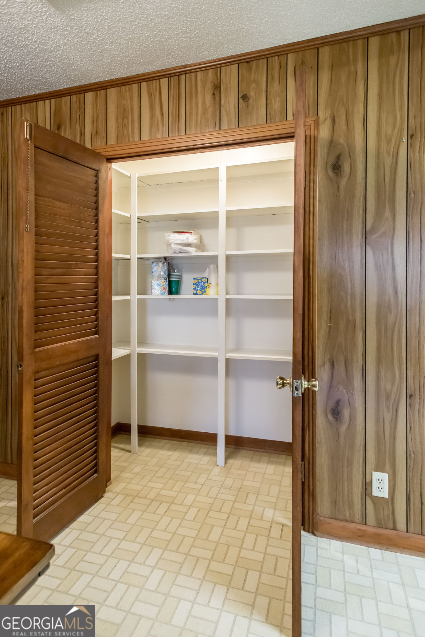 1917 Gilchrist Avenue Waycross, GA 31503 - Photo 13 of 42 a view of walk in closet with empty racks