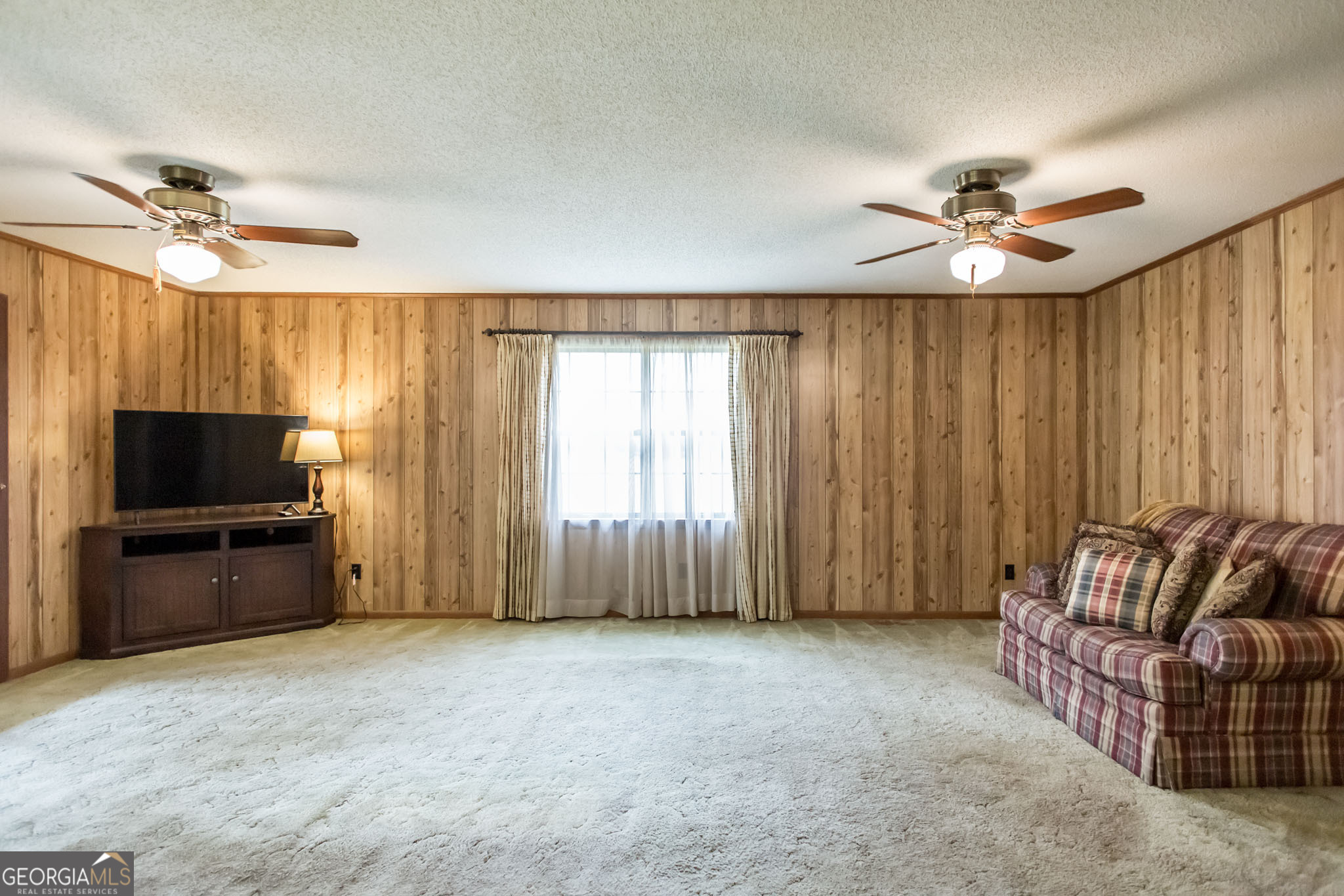 1917 Gilchrist Avenue Waycross, GA 31503 - Photo 16 of 42 a living room with furniture and a flat screen tv