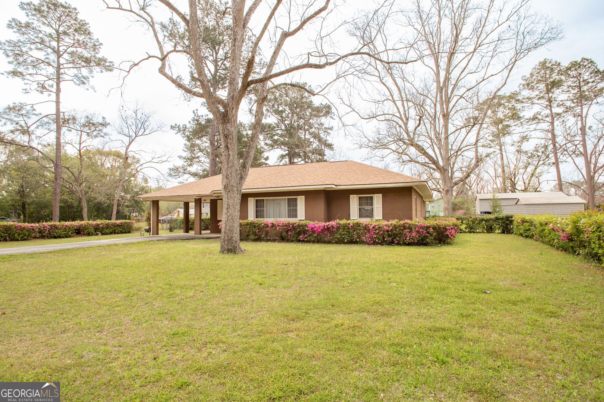 1917 Gilchrist Avenue Waycross, GA 31503 - Photo 2 of 42 a front view of a house with swimming pool