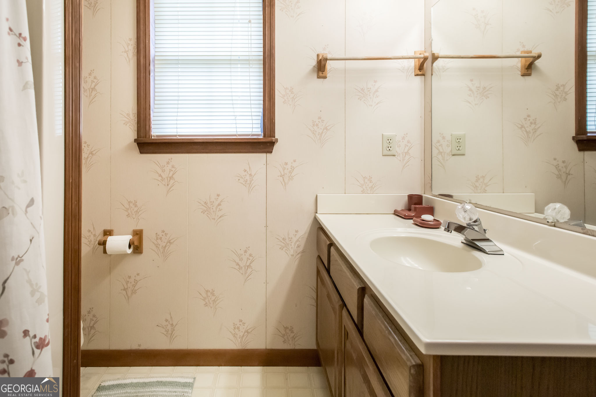1917 Gilchrist Avenue Waycross, GA 31503 - Photo 24 of 42 a bathroom with a sink and mirror